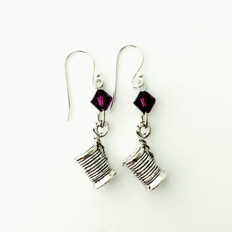 ____ Spool of Thread Silver Earrings with Purple Swarovski Crystals.